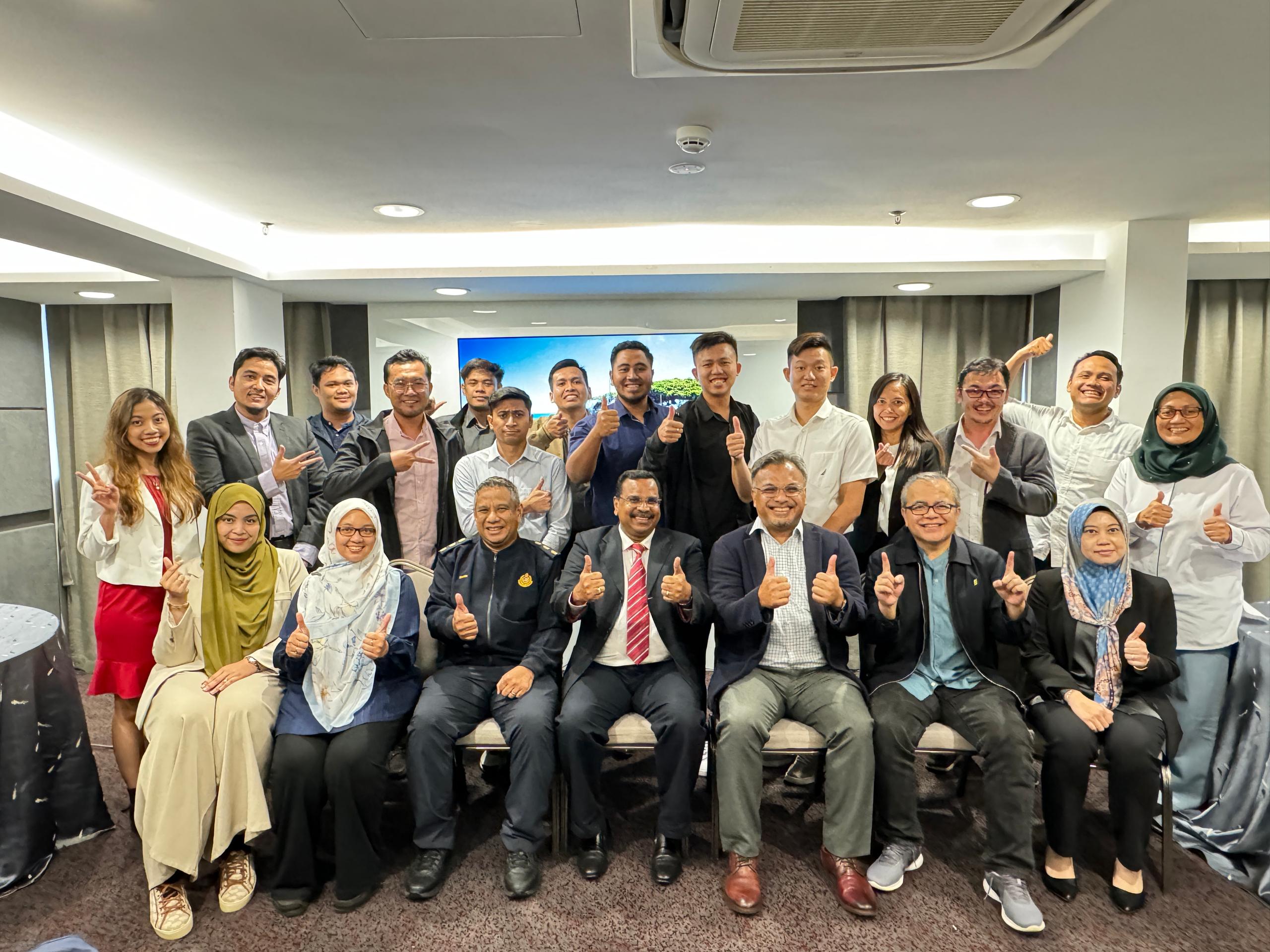 Train the Trainer participants celebrating together after a programme